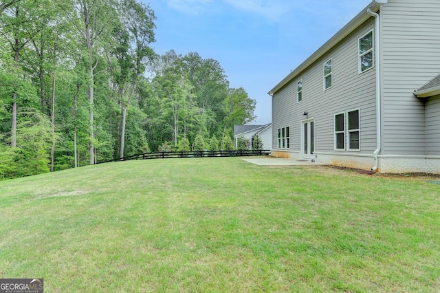 view of yard with fence and a patio area