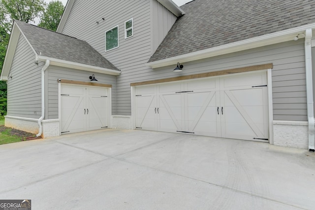 garage featuring driveway