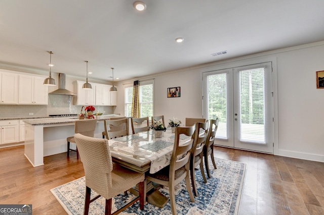 dining space featuring visible vents, french doors, recessed lighting, and light wood-style floors