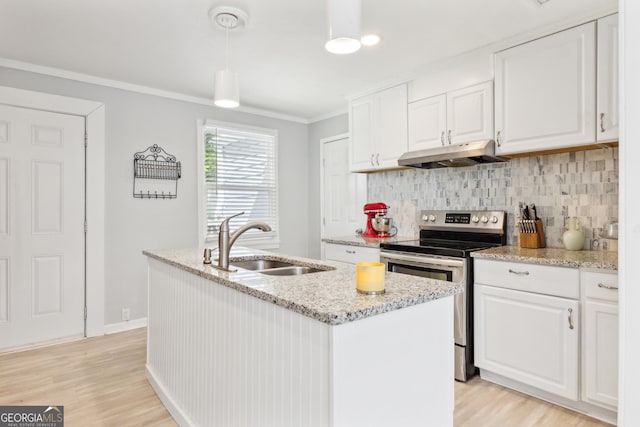 kitchen with tasteful backsplash, under cabinet range hood, white cabinets, a sink, and stainless steel electric stove