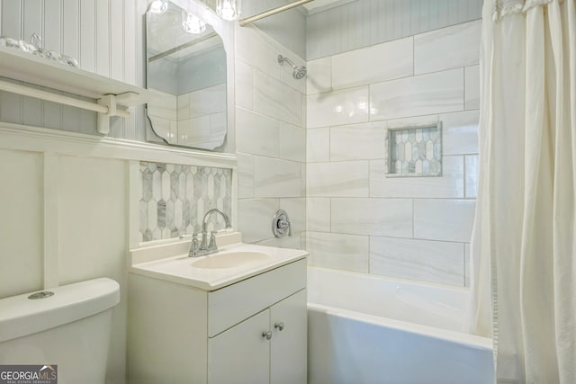 full bath with shower / bath combo with shower curtain, toilet, and vanity