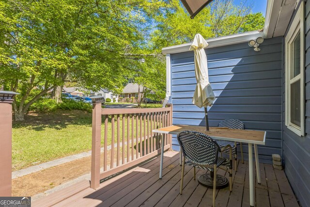 deck featuring a yard