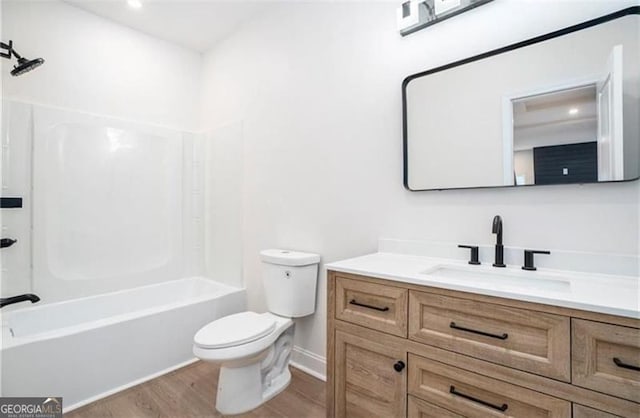 3105 Jones, Atlanta, GA 30344 - full bath featuring wood finished floors, toilet, shower / tub combination, vanity, and baseboards