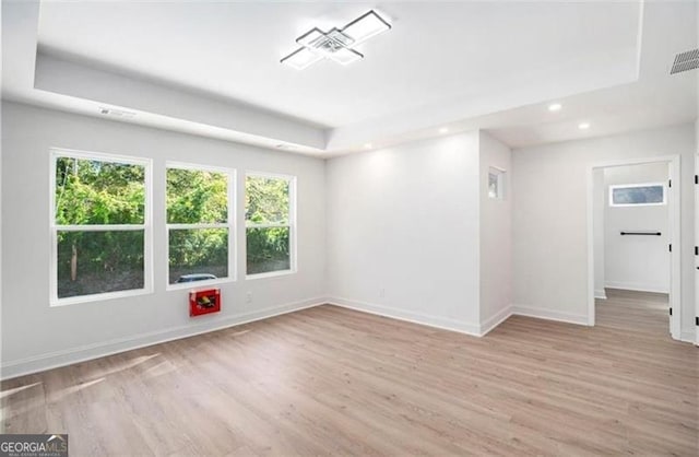 3105 Jones, Atlanta, GA 30344 - spare room featuring recessed lighting, wood finished floors, a raised ceiling, and plenty of natural light