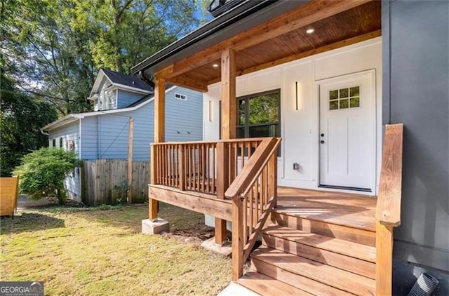 3105 Jones, Atlanta, GA 30344 - property entrance with covered porch, fence, and a lawn