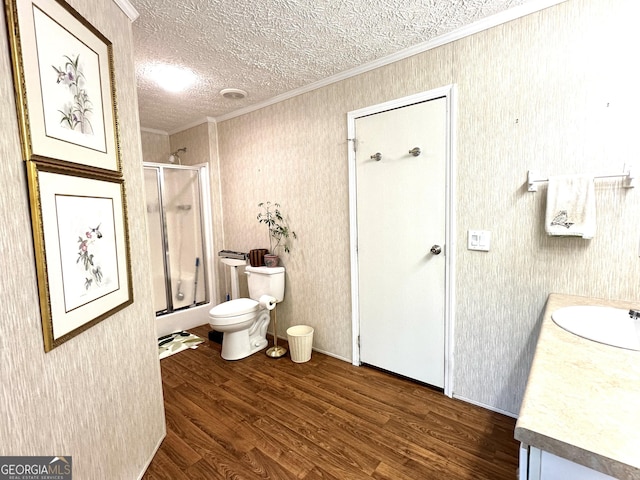 350 Kitty Hawk Ln, Clarkesville, GA 30523 - full bathroom featuring crown molding, vanity, wood finished floors, toilet, and a shower with shower door