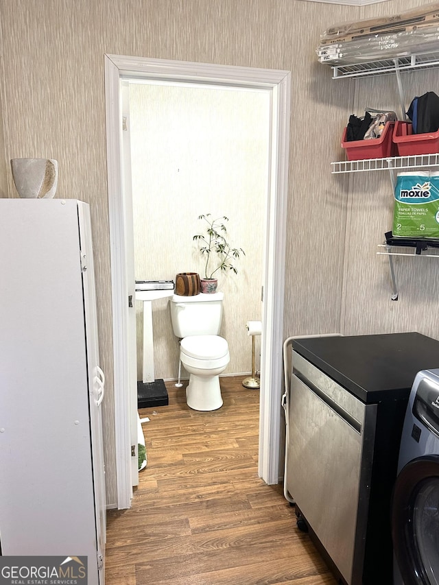 350 Kitty Hawk Ln, Clarkesville, GA 30523 - laundry area with washer / clothes dryer, wallpapered walls, wood finished floors, and laundry area