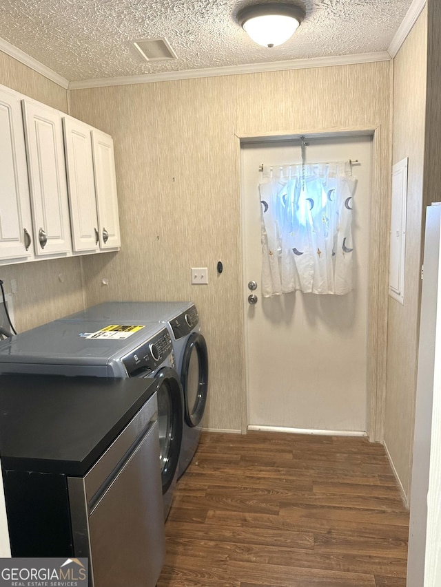 350 Kitty Hawk Ln, Clarkesville, GA 30523 - washroom with ornamental molding, dark wood-style flooring, cabinet space, and washing machine and clothes dryer