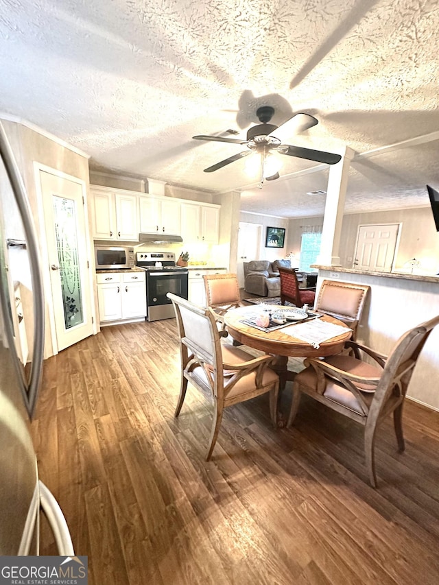 350 Kitty Hawk Ln, Clarkesville, GA 30523 - dining room with a textured ceiling, ceiling fan, and light wood-style flooring