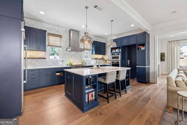 260 Jasmine Garden Way, Alpharetta, GA 30009 - kitchen featuring stainless steel appliances, blue cabinets, open shelves, and wall chimney range hood
