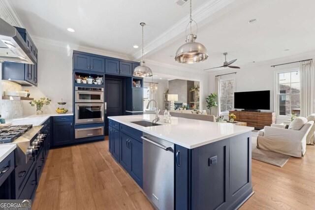 260 Jasmine Garden Way, Alpharetta, GA 30009 - kitchen featuring a sink, appliances with stainless steel finishes, wall chimney exhaust hood, blue cabinets, and open floor plan