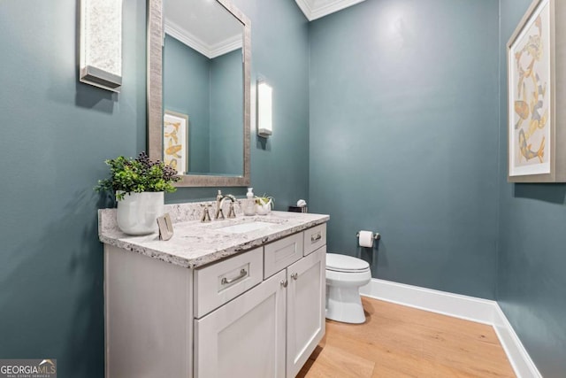 260 Jasmine Garden Way, Alpharetta, GA 30009 - bathroom featuring wood finished floors, ornamental molding, toilet, vanity, and baseboards