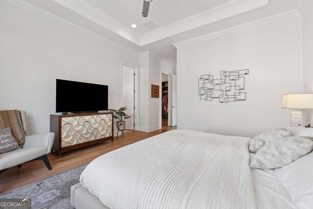 260 Jasmine Garden Way, Alpharetta, GA 30009 - bedroom featuring a raised ceiling, ceiling fan, recessed lighting, ornamental molding, and wood finished floors