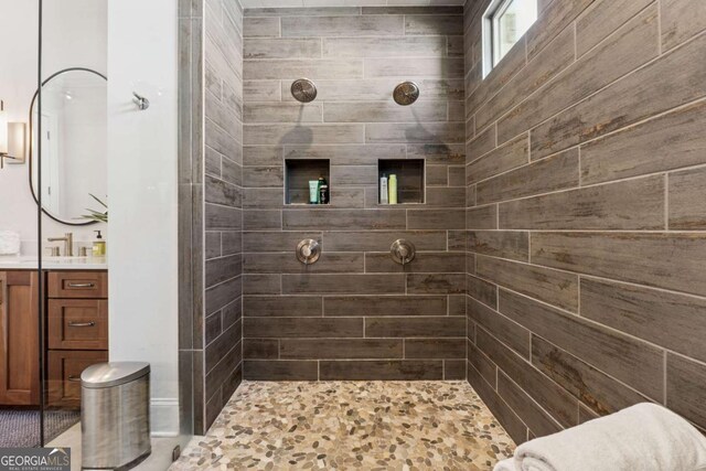 260 Jasmine Garden Way, Alpharetta, GA 30009 - bathroom featuring a tile shower and vanity