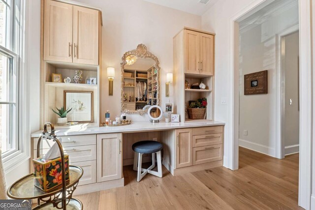 260 Jasmine Garden Way, Alpharetta, GA 30009 - bar featuring light wood-type flooring, plenty of natural light, and built in study area