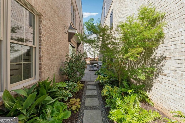 260 Jasmine Garden Way, Alpharetta, GA 30009 - view of side of home featuring a patio and brick siding