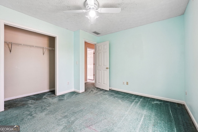 unfurnished bedroom featuring carpet floors, a textured ceiling, visible vents, and baseboards