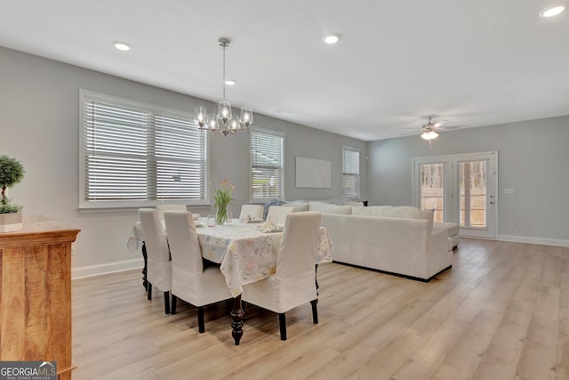 dining room featuring baseboards, recessed lighting, ceiling fan with notable chandelier, and light wood-style floors