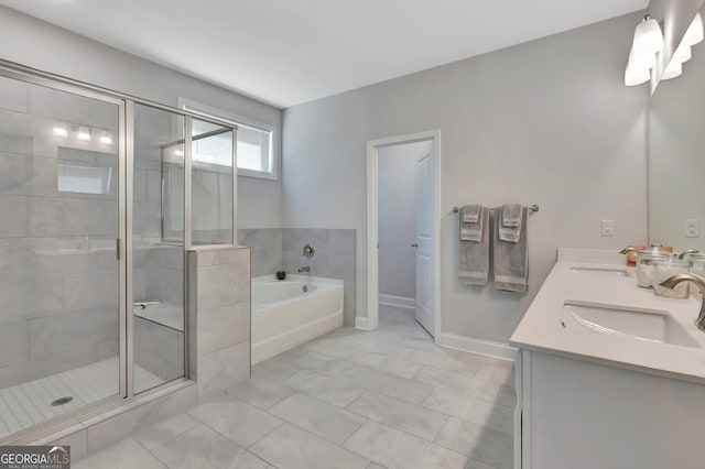 bathroom with double vanity, a bath, a stall shower, and a sink