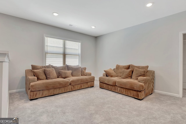 carpeted living area with recessed lighting, visible vents, and baseboards