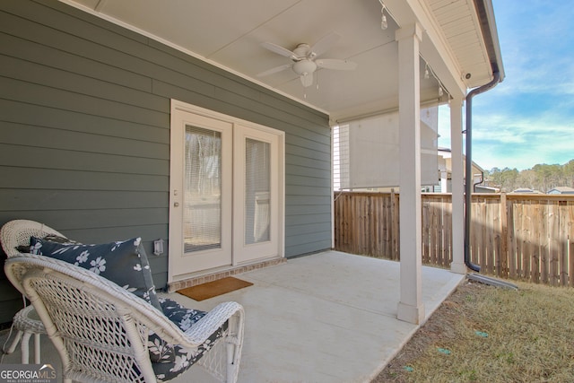 view of patio featuring a ceiling fan and fence