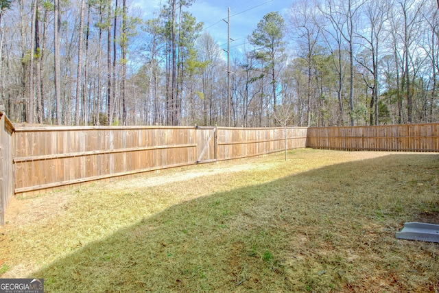view of yard featuring a fenced backyard
