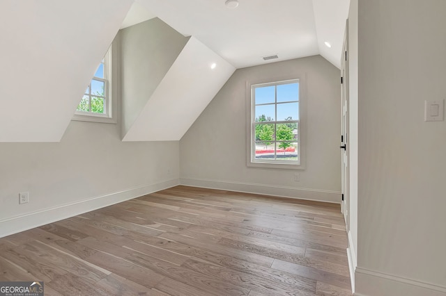 124 Morgan St, Senoia, GA 30276 - bonus room with hardwood / wood-style flooring, lofted ceiling, and baseboards