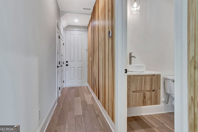 124 Morgan St, Senoia, GA 30276 - hallway featuring light wood finished floors and a sink