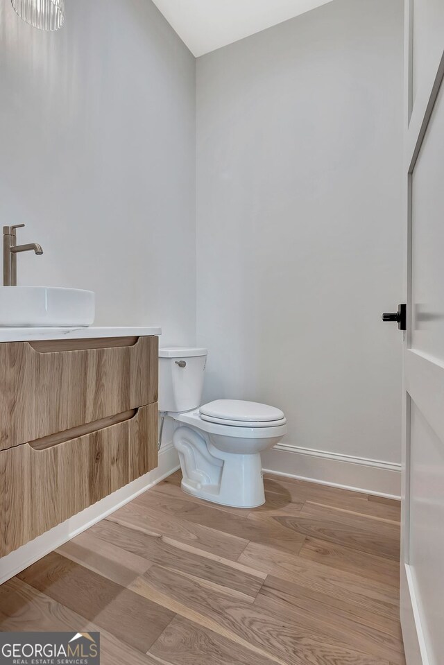 124 Morgan St, Senoia, GA 30276 - bathroom featuring toilet, baseboards, and vanity