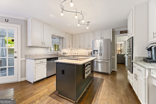 120 N Blf, Alpharetta, GA 30004 - kitchen with appliances with stainless steel finishes, white cabinets, crown molding, wood finished floors, and plenty of natural light