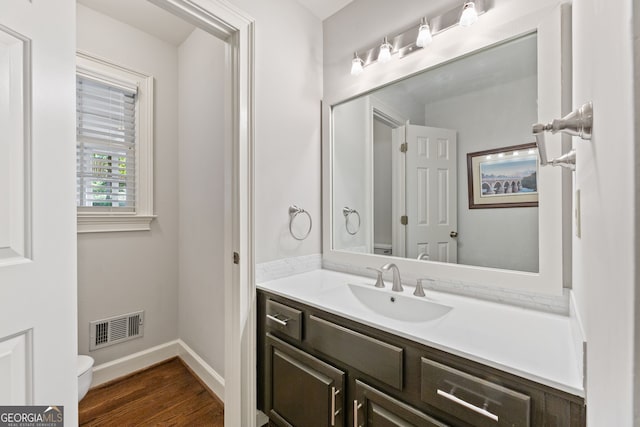 120 N Blf, Alpharetta, GA 30004 - bathroom with toilet, vanity, wood finished floors, and baseboards