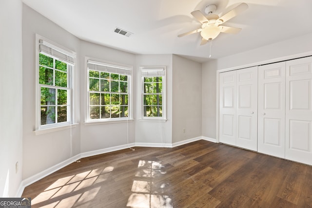120 N Blf, Alpharetta, GA 30004 - unfurnished bedroom featuring baseboards and multiple windows