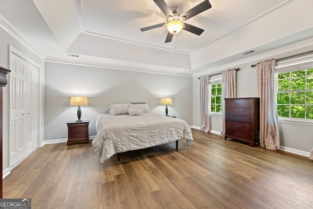 120 N Blf, Alpharetta, GA 30004 - bedroom featuring a raised ceiling, wood finished floors, baseboards, ceiling fan, and ornamental molding