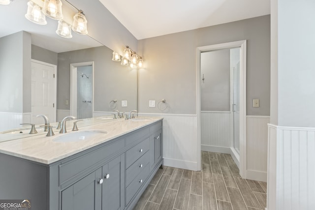 120 N Blf, Alpharetta, GA 30004 - full bathroom with a wainscoted wall, wood finished floors, a shower stall, and double vanity
