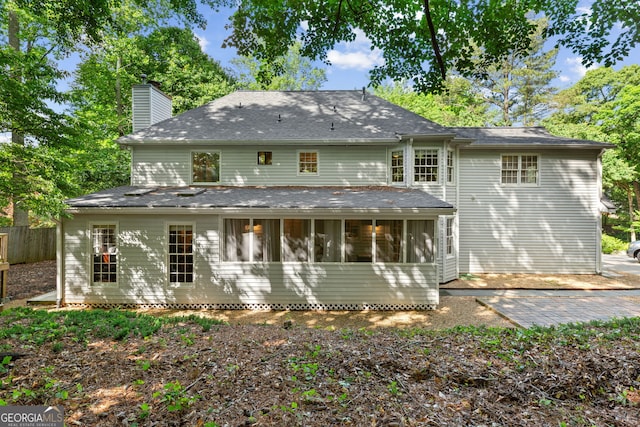 120 N Blf, Alpharetta, GA 30004 - back of property with a chimney, fence, and a sunroom