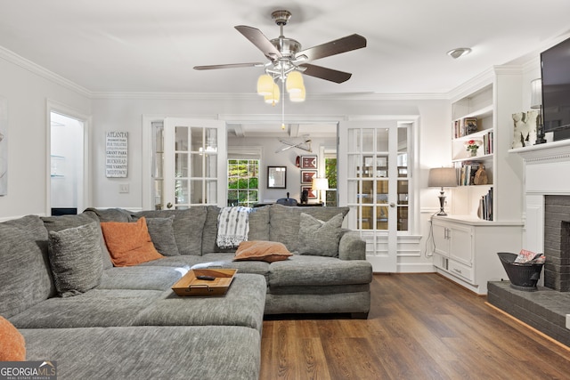 120 N Blf, Alpharetta, GA 30004 - living area with a ceiling fan, dark wood-type flooring, crown molding, and a brick fireplace