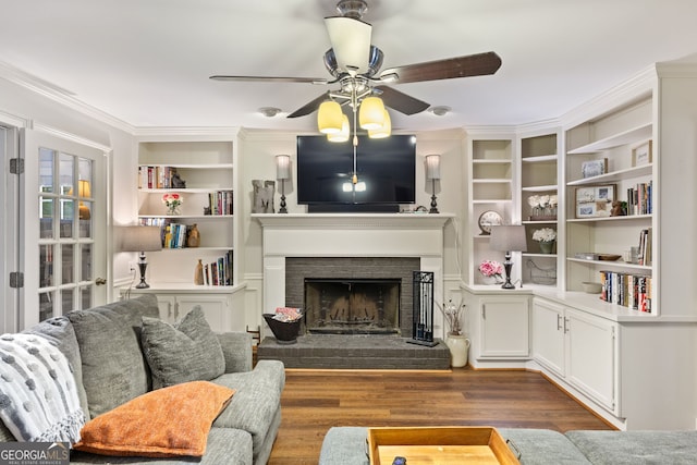 120 N Blf, Alpharetta, GA 30004 - living area with wood finished floors, ceiling fan, ornamental molding, a brick fireplace, and built in shelves
