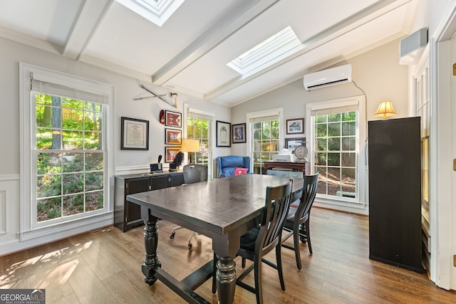 120 N Blf, Alpharetta, GA 30004 - home office with a skylight, an AC wall unit, wood finished floors, and healthy amount of natural light