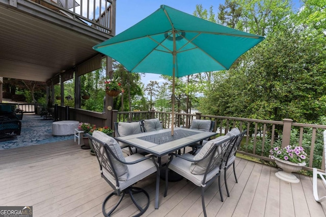 wooden deck with outdoor dining area