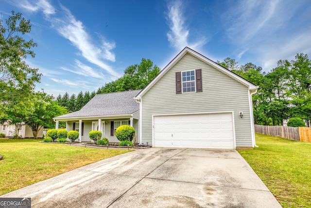 407 Gladiola Dr, Auburn, GA 30011 - traditional-style home with a front lawn, driveway, a garage, and fence