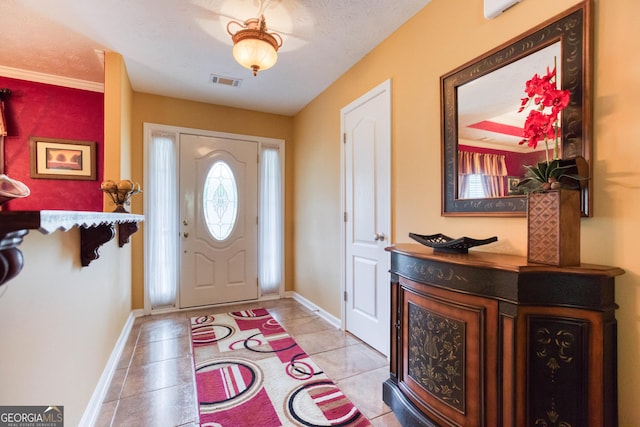 407 Gladiola Dr, Auburn, GA 30011 - entrance foyer with light tile patterned floors, visible vents, and baseboards