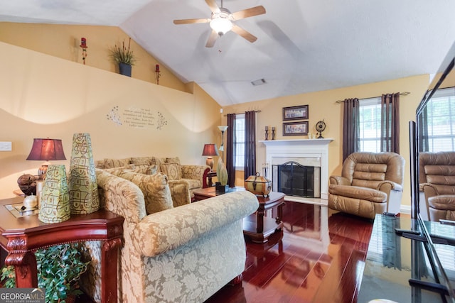 407 Gladiola Dr, Auburn, GA 30011 - living room with a fireplace, ceiling fan, lofted ceiling, visible vents, and wood finished floors