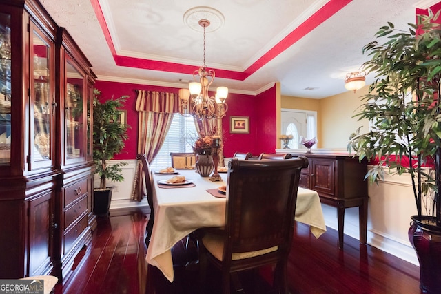 407 Gladiola Dr, Auburn, GA 30011 - dining room with an inviting chandelier, dark wood-type flooring, baseboards, crown molding, and a tray ceiling