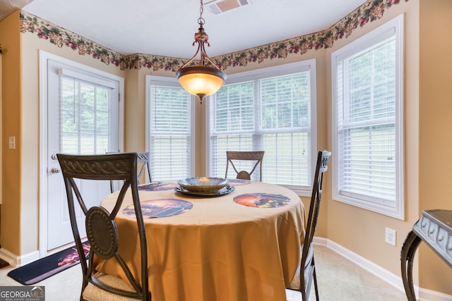 407 Gladiola Dr, Auburn, GA 30011 - dining area with light tile patterned floors, visible vents, and baseboards
