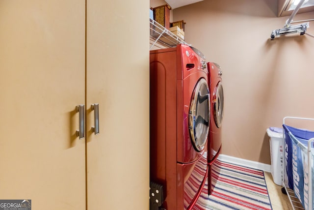 407 Gladiola Dr, Auburn, GA 30011 - clothes washing area with baseboards, laundry area, and washer and clothes dryer
