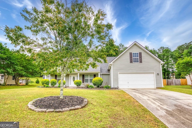 407 Gladiola Dr, Auburn, GA 30011 - view of front of house featuring concrete driveway, a garage, a front lawn, and fence