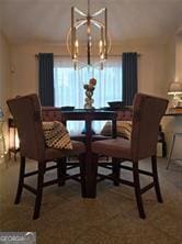 6193 Charring Cross Ct, Lithonia, GA 30058 - dining space featuring healthy amount of natural light and a chandelier