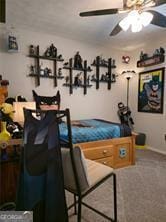 6193 Charring Cross Ct, Lithonia, GA 30058 - recreation room with a ceiling fan and carpet flooring