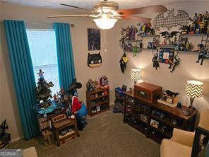 6193 Charring Cross Ct, Lithonia, GA 30058 - sitting room featuring ceiling fan and carpet floors