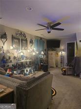 6193 Charring Cross Ct, Lithonia, GA 30058 - carpeted living room featuring ceiling fan